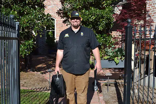 SBC tech with briefcase walking to residential home in Shreveport LA.