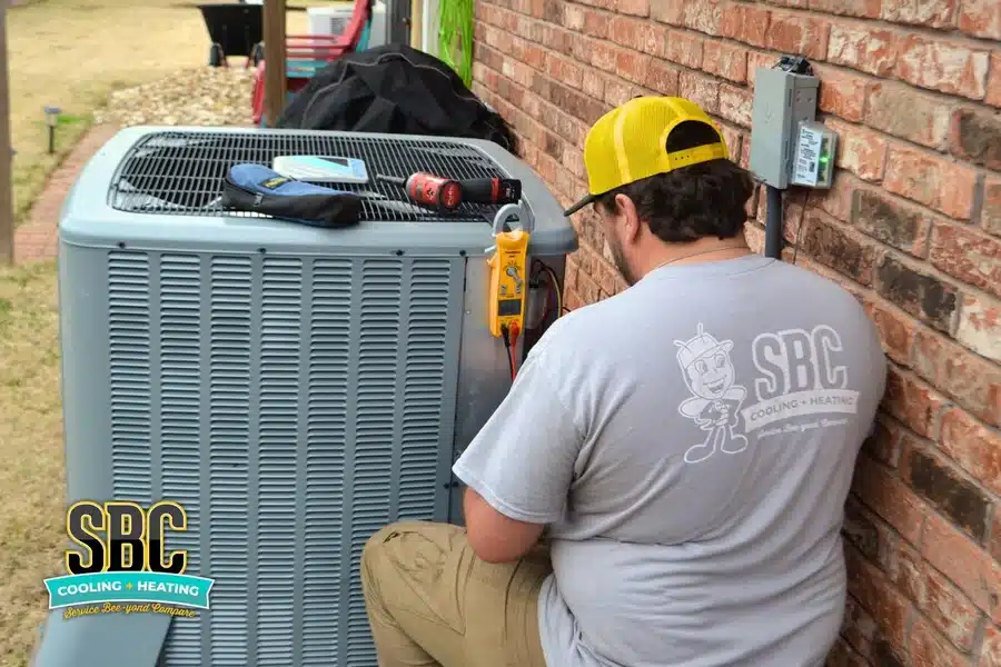 SBC Technician servicing outdoor AC condenser unit in Shreveport, Louisiana, providing professional HVAC maintenance and repair services